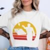 57aa5b65-661b-4c3f-bccc-4b9a19582b75 Eat Sleep Cornhole Repeat Retro Sunset T-Shirt